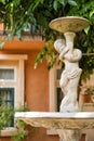 Beautiful outdoor marble fountains,boy holding a vase, vintage style