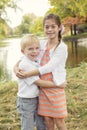 Beautiful outdoor portrait of a cute boy and girl