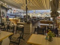 A beautiful outdoor restaurant cafe with a gorgeous view towards the Argosaronic gulf at the picuresque Greek Island of Hydra