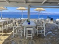 A beautiful outdoor restaurant cafe with a gorgeous view towards the Argosaronic gulf at the picuresque Greek Island of Hydra