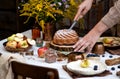 Beautiful outdoor still life in country garden with bundt cake on wooden stand on rustic table Royalty Free Stock Photo
