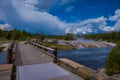 Beautiful outdoor view of wooden bridge over firehole river in the Yellowstone national park Royalty Free Stock Photo