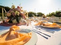 Beautiful outdoor wedding decoration in city. Candles and dried flowers and accessories with bouquets and glasses on Royalty Free Stock Photo