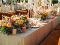 Beautiful outdoor wedding decoration in city. Candles and dried flowers and accessories with bouquets and glasses on Royalty Free Stock Photo