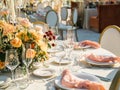 Beautiful outdoor wedding decoration in city. Candles and dried flowers and accessories with bouquets and glasses on Royalty Free Stock Photo