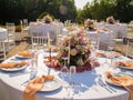 Beautiful outdoor wedding decoration in city. Candles and dried flowers and accessories with bouquets and glasses on Royalty Free Stock Photo