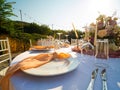 Beautiful outdoor wedding decoration in city. Candles and dried flowers and accessories with bouquets and glasses on Royalty Free Stock Photo