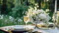 Beautiful outdoor wedding table setting with white flowers Royalty Free Stock Photo