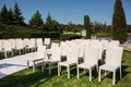 Beautiful outgoing wedding set up.Romantic wedding ceremony , wedding outdoor on the lawn water view. Wedding decor. White wooden Royalty Free Stock Photo