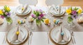 Festive Easter brunch table setting with spring flowers Royalty Free Stock Photo