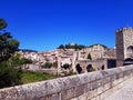 Beautiful overview of the Besalu medieval village in Catalonia from the stone old bridge on a summer sunny day.
