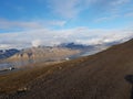 Beautiful overview photo of parts of longyear city airport with mighty mountains and sea Royalty Free Stock Photo