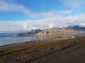 Beautiful overview photo of parts of longyear city airport with mighty mountains and sea Royalty Free Stock Photo