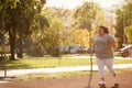 Beautiful overweight woman running in park
