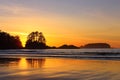 Tofino, Vancouver Island with Beautiful Pacific Sunset behind Frank Island at Chesterman Beach, British Columbia, Canada Royalty Free Stock Photo
