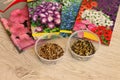 Beautiful packages with seeds of annual flowers and seed jars