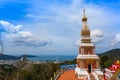 Beautiful pagoda of Thepnimit temple on high peak of Patong