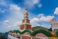 Beautiful pagoda of Thepnimit temple on high peak of Patong