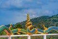 Beautiful pagoda of Thepnimit temple on high peak of Patong