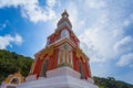 Beautiful pagoda of Thepnimit temple on high peak of Patong