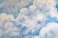 Beautiful painting of clouds and sky on cement wall. Scratched blue wall texturebackdrop surface. Concrete wall with clouds and Royalty Free Stock Photo