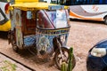 Beautiful painting three wheels vehicle parking in Pisac