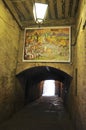 Painture panel in the Historic Passage from Downtown of Siena Medieval City. Tuscany. Italy