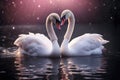 A beautiful pair of swans with their necks form a heart. Beautiful magical background.Mating games of a pair of white swans. Swans