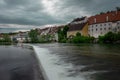 Beautiful panorama of the city of Steyr in upper Austria, rising above the river of Enns on the green river banks. River and small