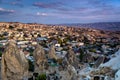 Beautiful landscape of Goreme on sunrise.Cappadocia.Turkey. View of rock formations fairy chimneys, hotels and houses at the cave. Royalty Free Stock Photo