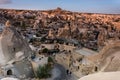 Beautiful landscape of Goreme on sunrise.Cappadocia.Turkey. View of rock formations fairy chimneys, hotels and houses at the cave. Royalty Free Stock Photo