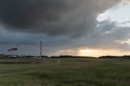 Beautiful panorama landscape with sun and forest and meadow at sunrise. sun rays shine through clouds. scenic and panoramic view Royalty Free Stock Photo