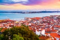 Beautiful panorama of old town Baixa district and Tagus River in Lisbon city during sunset, seen from Sao Jorge Castle Royalty Free Stock Photo