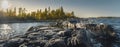 Beautiful panorama of a rocky shore. Nordic sunrise or sunset. Scenic view