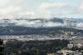 A beautiful panorama of San Francisco downtown and the famous Golden Gate Bridge in the fog as seen from the Twin Peaks, Royalty Free Stock Photo