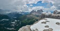 Beautiful panorama from Sass Pordoi, Italy. Dolomites Alps and Fassa Valley under the rain