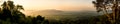 Panorama scenery during sunrise time with mountain and savannah field