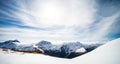 Beautiful panorama of the snow capped mountains with the snowy Mount Aspiring in the background taken on a sunny winter day in Royalty Free Stock Photo