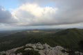 Beautiful panorama summer day view of green hills and mountains, a blue sky and big white clouds. Mallorca island, Spain Royalty Free Stock Photo