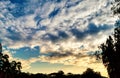 Beautiful panorama at sunset. Beautiful view in the clouds with trees Royalty Free Stock Photo