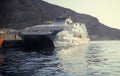 Small crusing ship mooring in Santorini island, Greece.