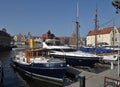 Beautiful panorama view of cityscape with sailboats mooring in the Old Town in Gdansk Royalty Free Stock Photo