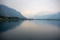 Beautiful panorama view of Geneva lake on small village, mountain and cloudy sky background Royalty Free Stock Photo