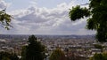 Beautiful panorama view over the historic center of Paris, France from a viewpoint with trees on hill Montmartre. Royalty Free Stock Photo