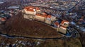 Beautiful panoramic aerial view to Palanok Castle at sunset and the city of Mukachevo Royalty Free Stock Photo