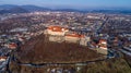 Beautiful panoramic aerial view to Palanok Castle at sunset and the city of Mukachevo Royalty Free Stock Photo
