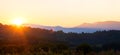 Beautiful panoramic mountain landscape with hazy peaks and foggy valley at sunset Royalty Free Stock Photo