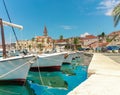 Beautiful panoramic picturesque view of a small town of Milna on the island of Brac. Old boats docked in the crystal clear sea,