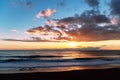 Beautiful panoramic seascape with golden sunset. Dramatic sky with clouds over sea in the evening Royalty Free Stock Photo