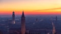 Beautiful panoramic sunset view of old town of Verona, Torre Lamberti and Santa Anastasia bell tower covered with evening fog.